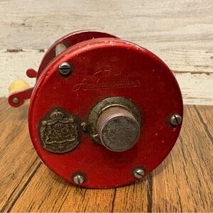 Red ABU Ambassadeur Fishing Reel